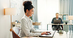 Woman with desk, laptop and typing in coworking space, market research and online schedule at consulting agency. Office, admin business and girl at computer writing email review, feedback or report.