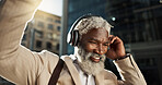 Happy, dancing and senior businessman with headphones in the city walking and listening to music. Smile, happy and elderly African male person streaming playlist, song or radio commuting in town.