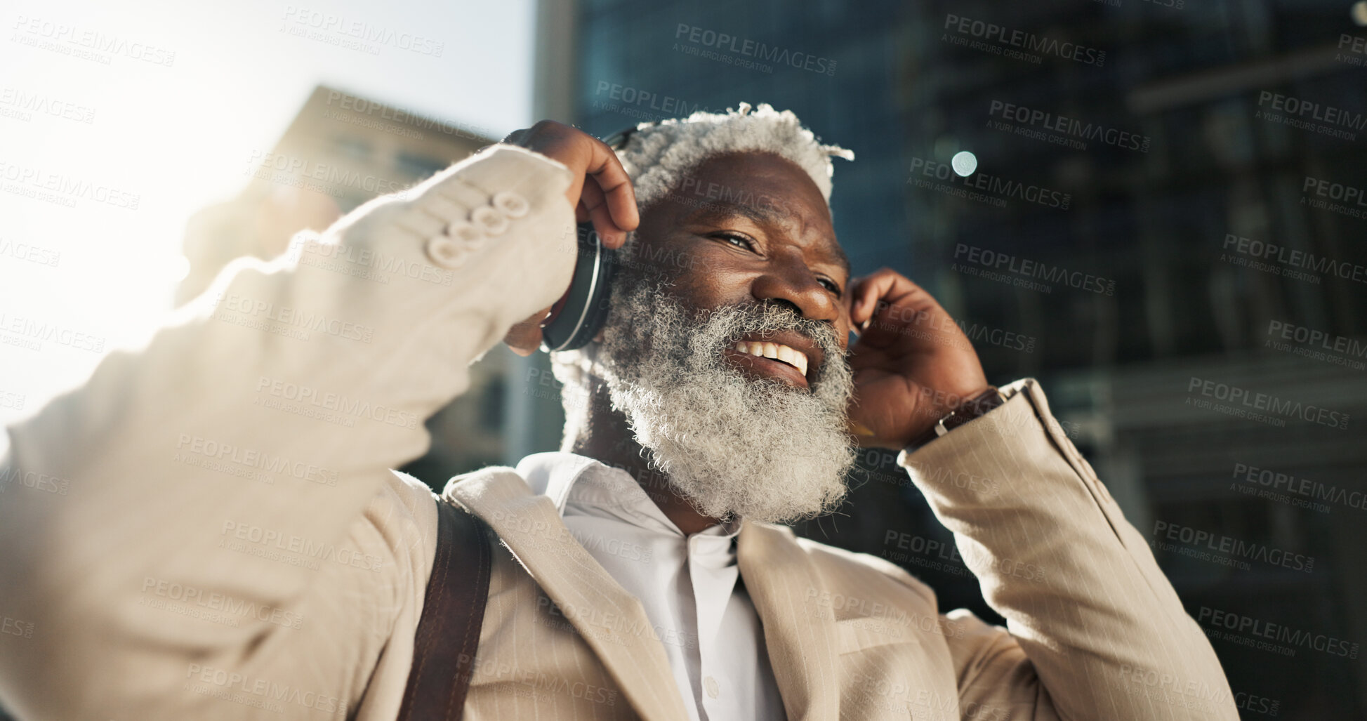 Buy stock photo Happy, dancing and senior businessman with headphones in the city walking and listening to music. Smile, happy and elderly African male person streaming playlist, song or radio commuting in town.