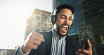 Happy, dance and businessman with headphones in city for job promotion celebration with phone. Smile, cellphone and excited professional young male person listening to music, radio or album in town.