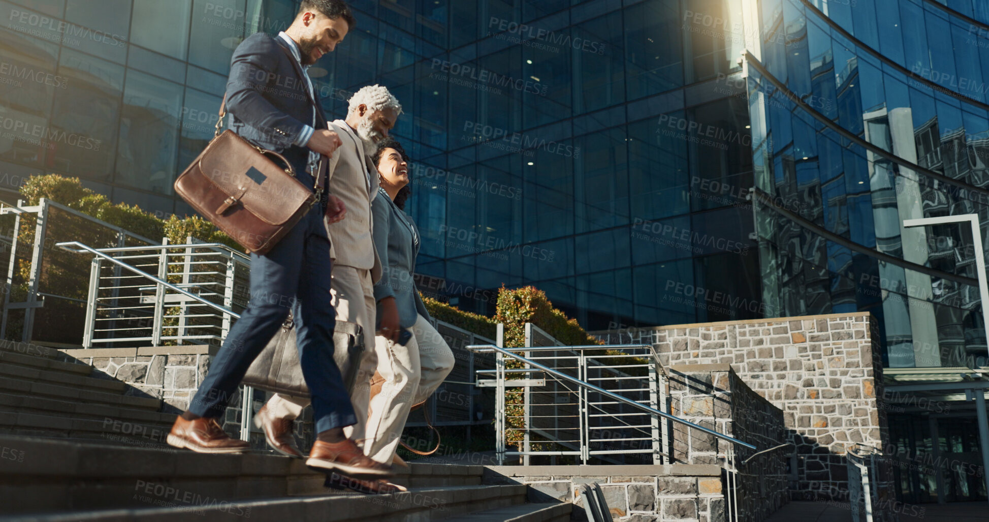 Buy stock photo Business people, stairs and outdoor in city with conversation for travel, commute or walking to work. Employee, professional and colleague with briefcase, communication and happy on steps by building