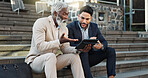 Tablet, conversation and business men in the city in discussion for corporate legal case. Teamwork, collaboration and male attorneys with digital technology sitting and talking on stairs in town.