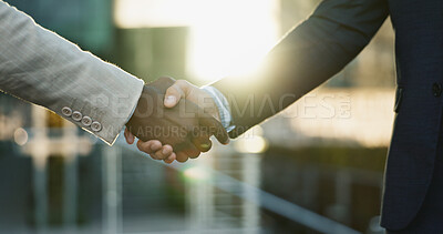Business people, shaking hands and city meeting for b2b partnership, outdoor deal and travel success. Corporate or professional clients handshake for consulting, welcome or introduction in urban town