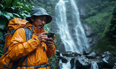 Buy stock photo Waterfall, smartphone and looking with hiking gear for travel, freedom or vacation. Health, activity and outdoors with person on landscape view for wellness, motivation or discovery in nature