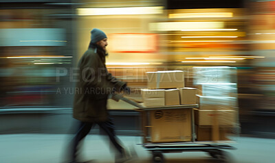 Delivery service, cardboard box and man pushing a cart for courier business company, food parcel or distribution. Blurred, transportation and employee for online shopping, ecommerce or shipment