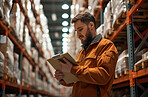 Warehouse, business and man employee or manager checking clipboard or product for courier service, delivery or exports. Confident, successful and hard working male at factory for parcels or inventory
