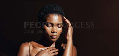 Face, hands and beauty with a natural black woman on a dark background in studio for feminine wellness. Portrait, skincare and spa with a young model touching her body or skin in satisfaction