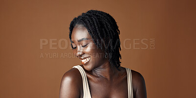 Face, beauty and aesthetic with funny black woman in studio isolated on brown background for wellness. Portrait, skincare and laughing for natural cosmetics or foundation with confident young person