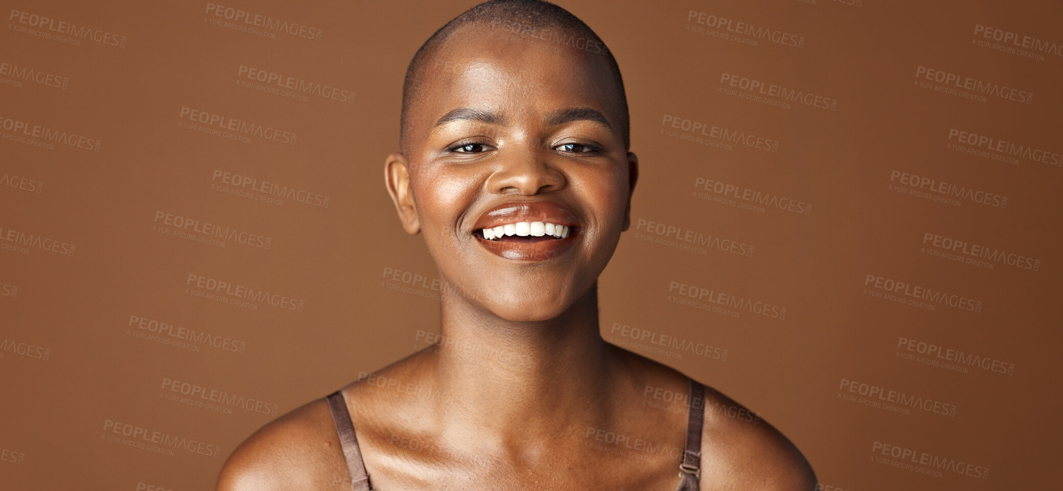 Buy stock photo Face, beauty and smile with happy black woman in studio isolated on brown background for wellness. Portrait, skincare and aesthetic for foundation cosmetics or dermatology with a natural bald person