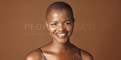 Buy stock photo Face, beauty and smile with happy black woman in studio isolated on brown background for wellness. Portrait, skincare and aesthetic for foundation cosmetics or dermatology with a natural bald person