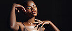 Face, hands and skin with a natural black woman on a dark background in studio for feminine wellness. Portrait, beauty and spa with a tender young model touching her body in skincare satisfaction