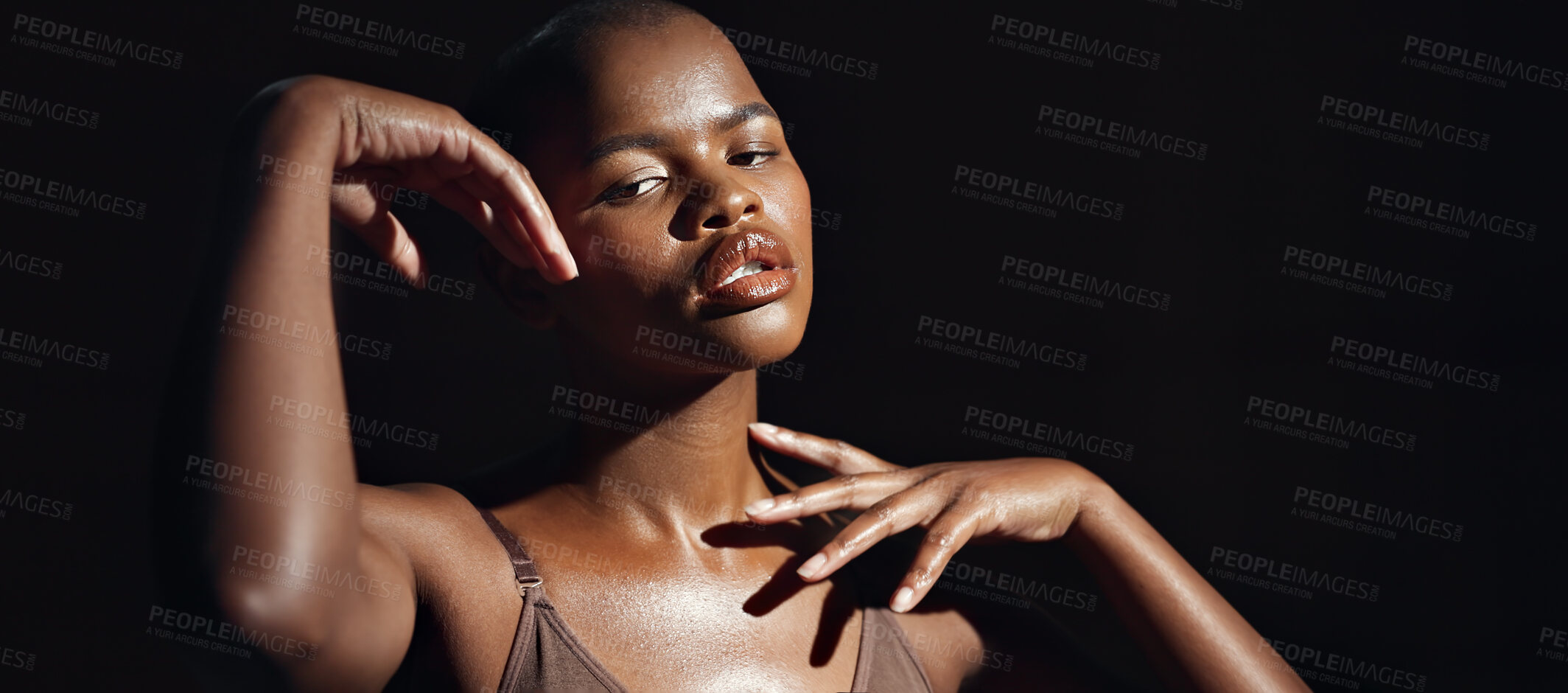 Buy stock photo Face, hands and skin with a natural black woman on a dark background in studio for feminine wellness. Portrait, beauty and spa with a tender young model touching her body in skincare satisfaction