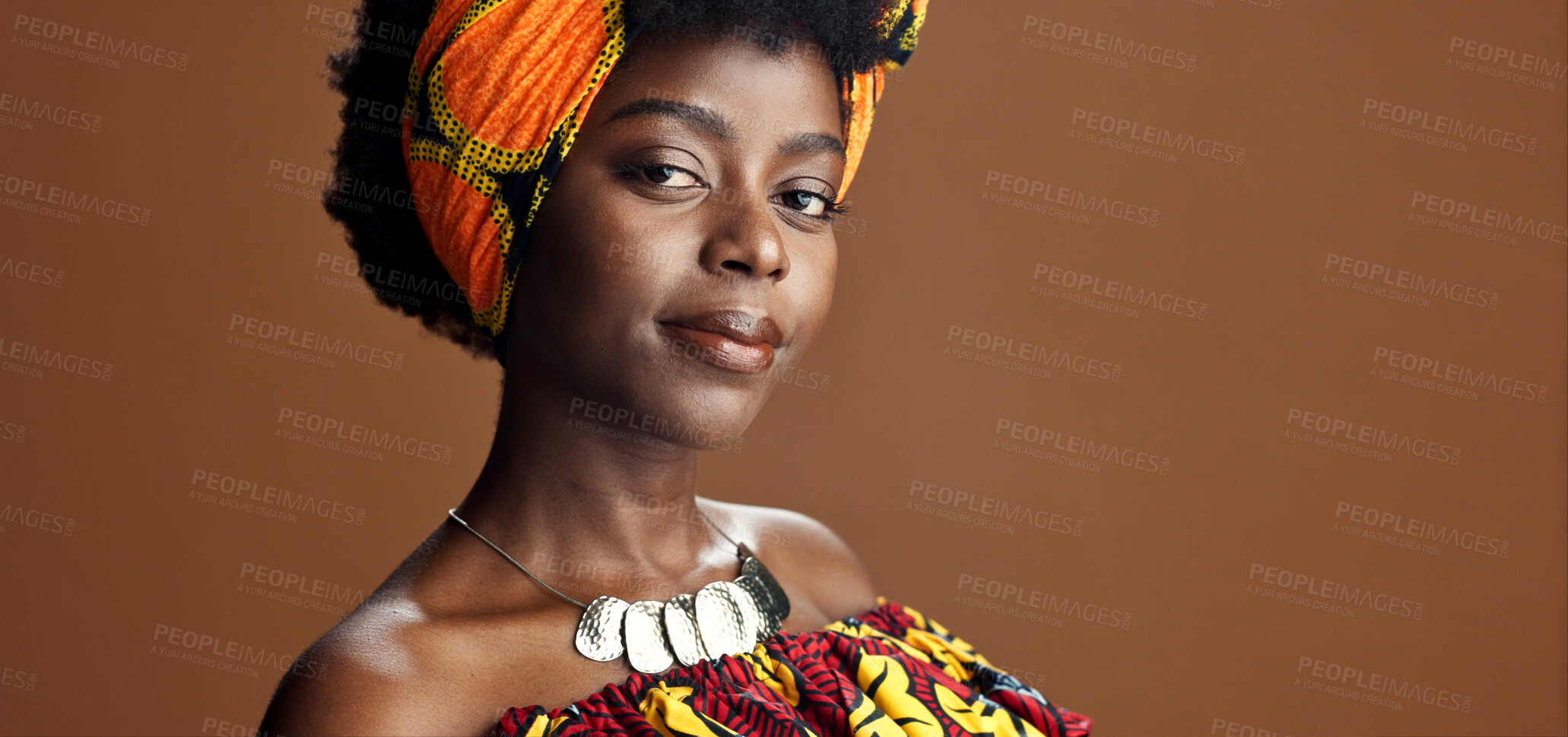 Buy stock photo Culture, African fashion or face of black woman in studio on a brown background for trendy style. Unique, beauty or model with confidence, pride or afro posing in wrap, clothes or traditional outfit