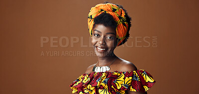 Buy stock photo Wrap, fashion or face of happy black woman in studio on a brown background for trendy style. Smile, African or model with confidence, pride or afro posing in culture, clothes or traditional outfit