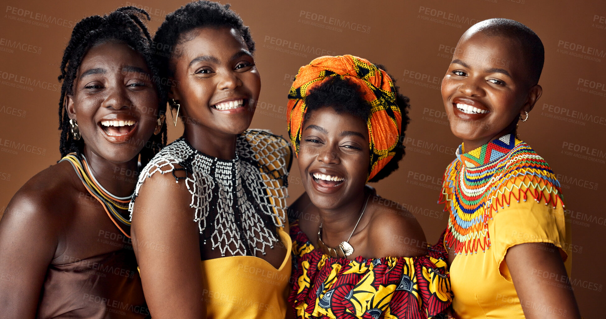 Buy stock photo Traditional African women, group and studio for face, jewelry or beads necklace in clothes by brown background. Black people, model and indigenous fashion for friends, culture or portrait for kwanzaa