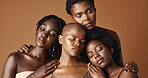 Skincare, beauty and face of black women in studio with glowing, natural and facial routine. Smile, cosmetic and portrait of African female friends with dermatology face treatment by brown background