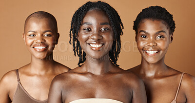 Face, beauty and natural with black woman friends in studio on a brown background for a wellness routine. Portrait, skincare and smile with a group of people looking confident at antiaging treatment