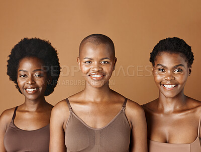 Face, skincare and natural with black woman friends in studio on a brown background for a wellness routine. Portrait, aesthetic and smile with a group of people looking happy at beauty treatment