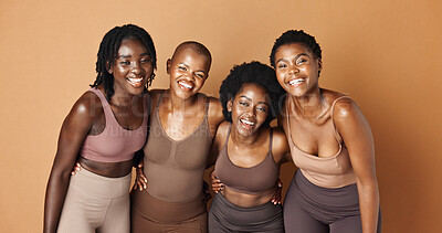Laughing, face or African models with skincare, glowing skin or results isolated on brown background. Facial dermatology, friends hug or natural beauty in studio with black women or happy people