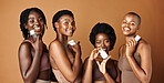 Happy black woman, skincare and cosmetics for beauty, tone or foundation against a brown studio background. Group portrait of African female people or model smile together with skin makeup on mockup