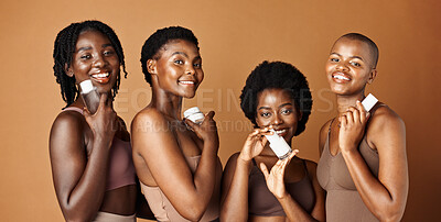 Happy black woman, skincare and cosmetics for beauty, tone or foundation against a brown studio background. Group portrait of African female people or model smile together with skin makeup on mockup