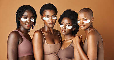 Face, happy or black women with eye patch for skincare or beauty isolated on brown background. Studio, smile or African models with facial collagen pads, dermatology product or anti aging cosmetics