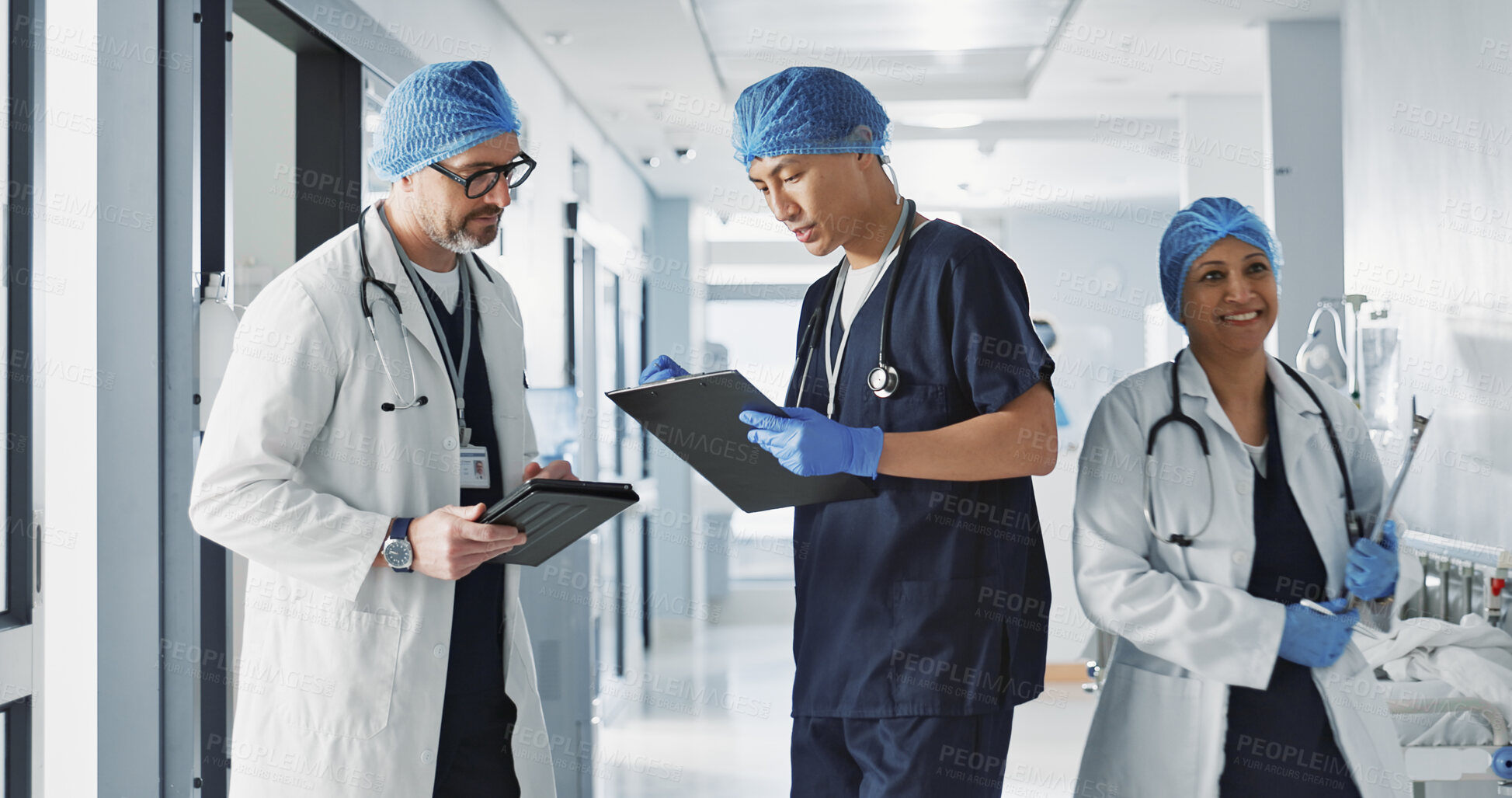 Buy stock photo Teamwork, talking and doctors with a tablet at a hospital for health advice or surgery communication. Help, clinic and medical employees speaking with technology, planning and schedule for nursing