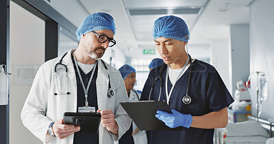 Teamwork, talking and doctors with a tablet at a hospital for health advice or surgery communication. Help, clinic and medical employees speaking with technology, planning and schedule for nursing