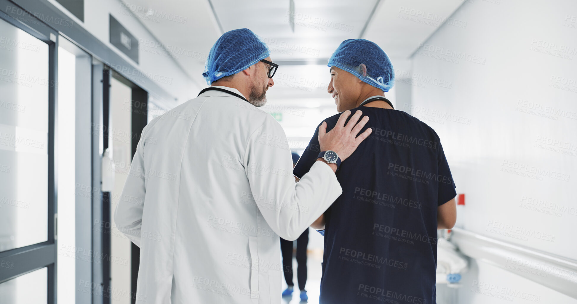 Buy stock photo Doctor, nurse and talk while walk in hospital with advice, consult or communication with medical team. People, discuss or coaching for patient care, treatment and wellness after surgery with joke