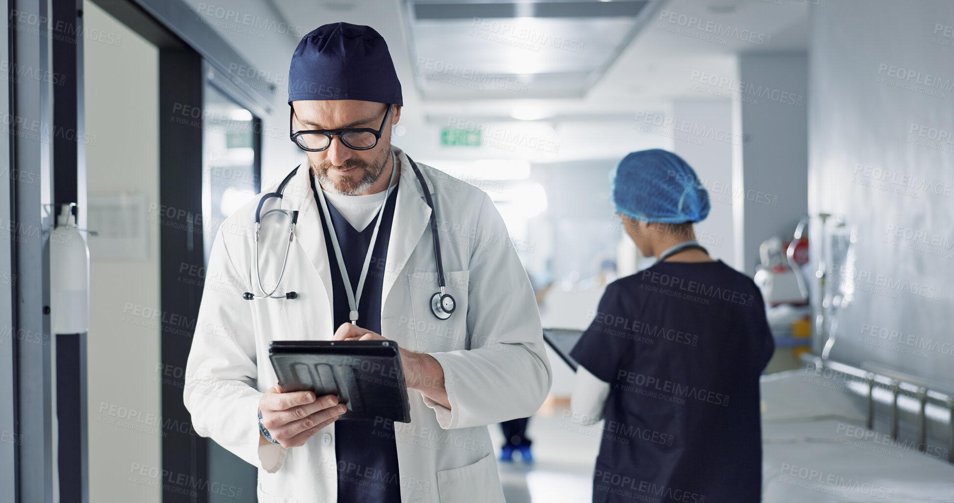 Buy stock photo Surgeon, doctor and tablet for hospital, healthcare or clinic research, online planning and schedule management. Medical professional typing on digital technology for surgery results, charts or data