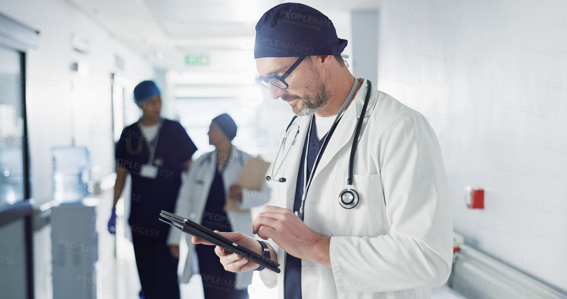 Buy stock photo Man, doctor and tablet for hospital, healthcare or clinic research, online planning and schedule management. Medical professional or surgeon typing on digital technology for surgery results or data