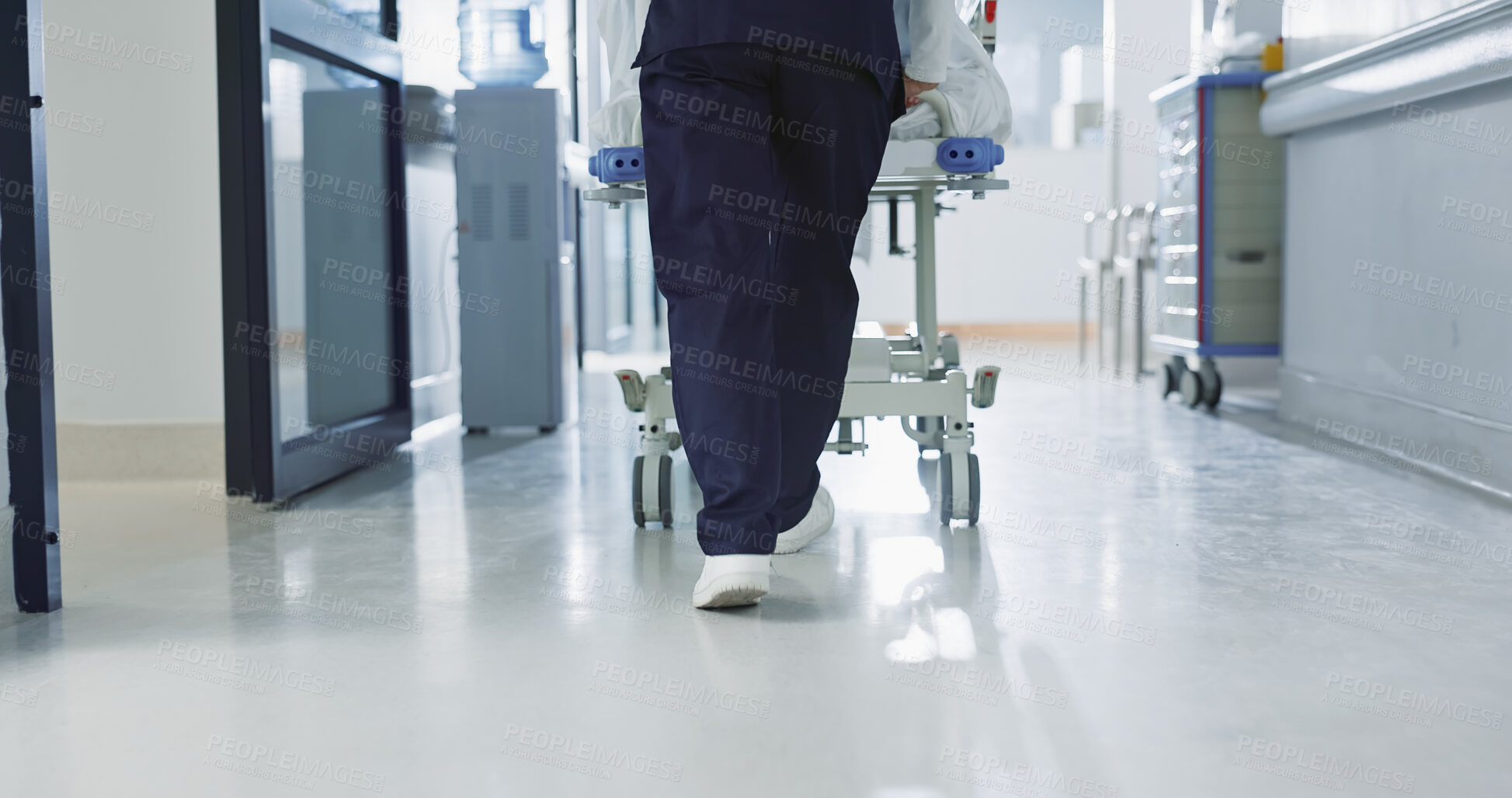 Buy stock photo Nurse, feet and walking patient in hospital, bed or steps in hallway or corridor to surgery, operation room or ER healthcare. Doctor, moving and pushing person in clinic to ICU, bedroom or walk