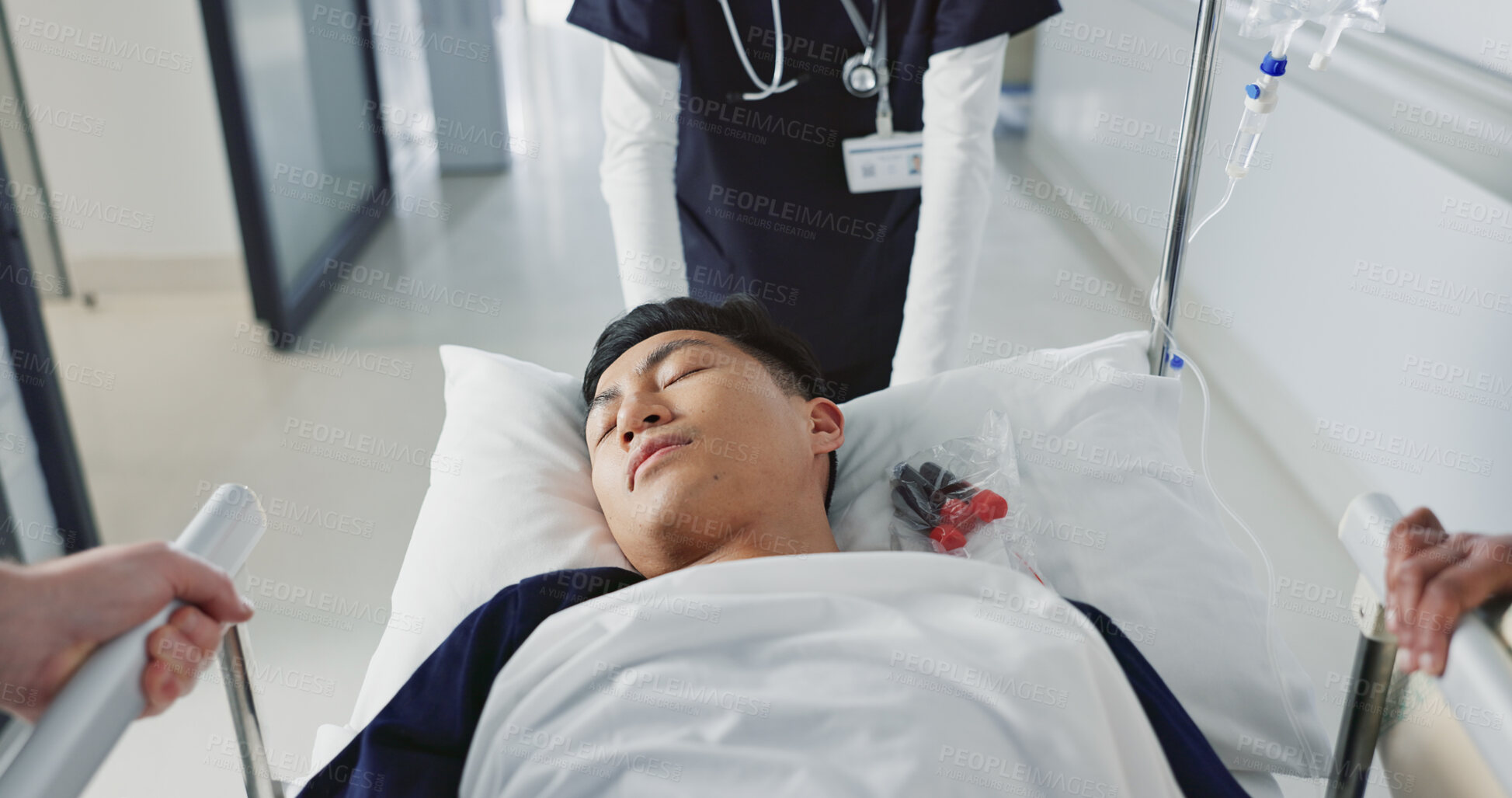 Buy stock photo Asian man, patient and push bed in hospital for surgery, emergency or medical problem in corridor. Medicine, professional or person with stretcher for wellness, service and risk in clinic or job