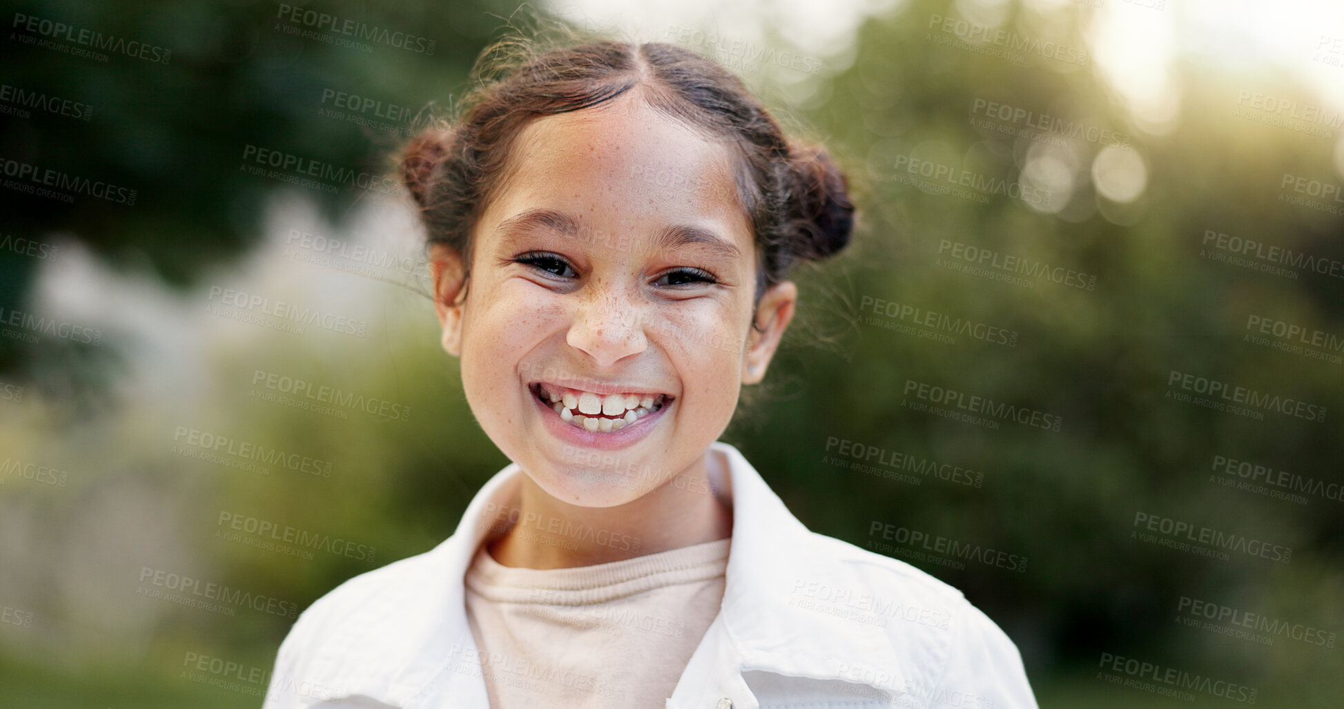 Buy stock photo Child, face and girl laughing outdoor in a garden, park or green environment for fun and happiness. Portrait of a young female latino kid with a positive mindset, cute smile and nature to relax