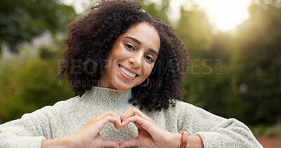 Face, smile and woman with heart hands, outdoor and support with emoji, kindness and wellness. Portrait, female person or happy girl with symbol for love, self care or peace with trust, park and care