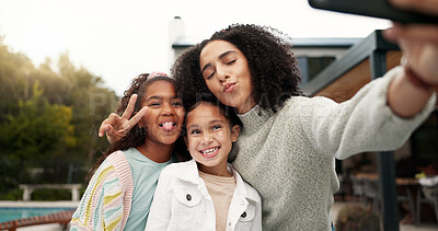 Family, selfie and children outdoor with a smile, love and care in home backyard. Face of young latino woman, woman or parent for a picture with happy kids for social media post or profile picture