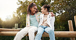 Friends, happy and children hug in park on jungle gym for bonding, childhood and having fun on playground. Friendship, outdoors and portrait of young girls embrace for playing, freedom and adventure