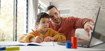 Father, boy child and homework with laptop, writing and helping hand for education, childhood development or care. Man, dad and male kid with home school, notebook and computer with teaching at desk