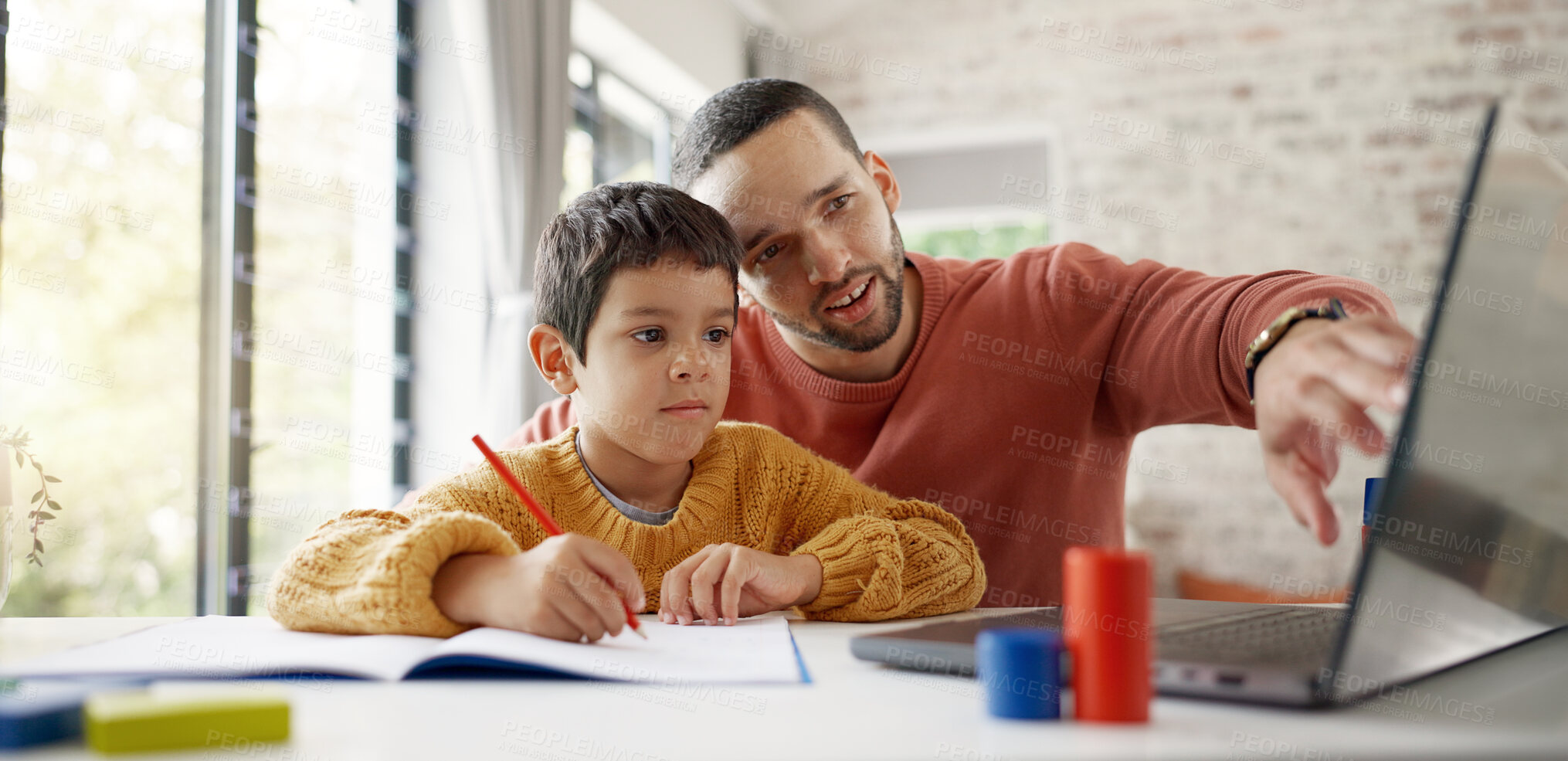 Buy stock photo Father, boy child and homework with laptop, writing and helping hand for education, childhood development or care. Man, dad and male kid with home school, notebook and computer with teaching at desk