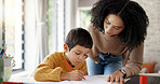 Homework, learning and help with mother and son for homeschooling, research and math. Education, study and teaching with woman and kid in family home for child development, writing and knowledge