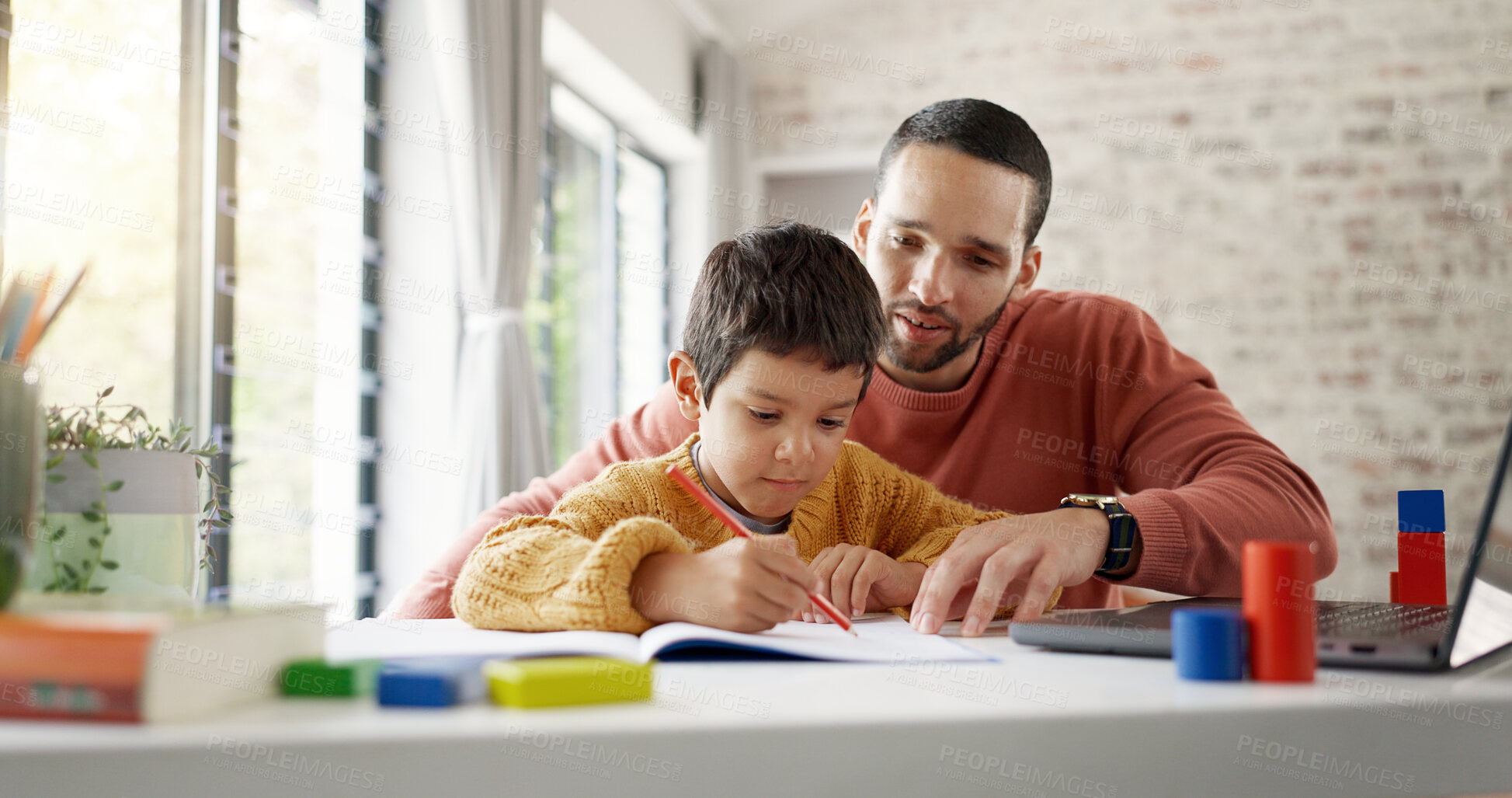 Buy stock photo Father, boy child and homework with laptop, writing and helping hand for education, childhood development or care. Man, dad and male kid with home school, notebook and computer with teaching at desk