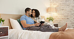 Couple, tablet and relax in home bedroom, laugh or morning with video, movie or meme for love, care or hug. Man, woman and digital touchscreen for typing, social network app or bond together in house