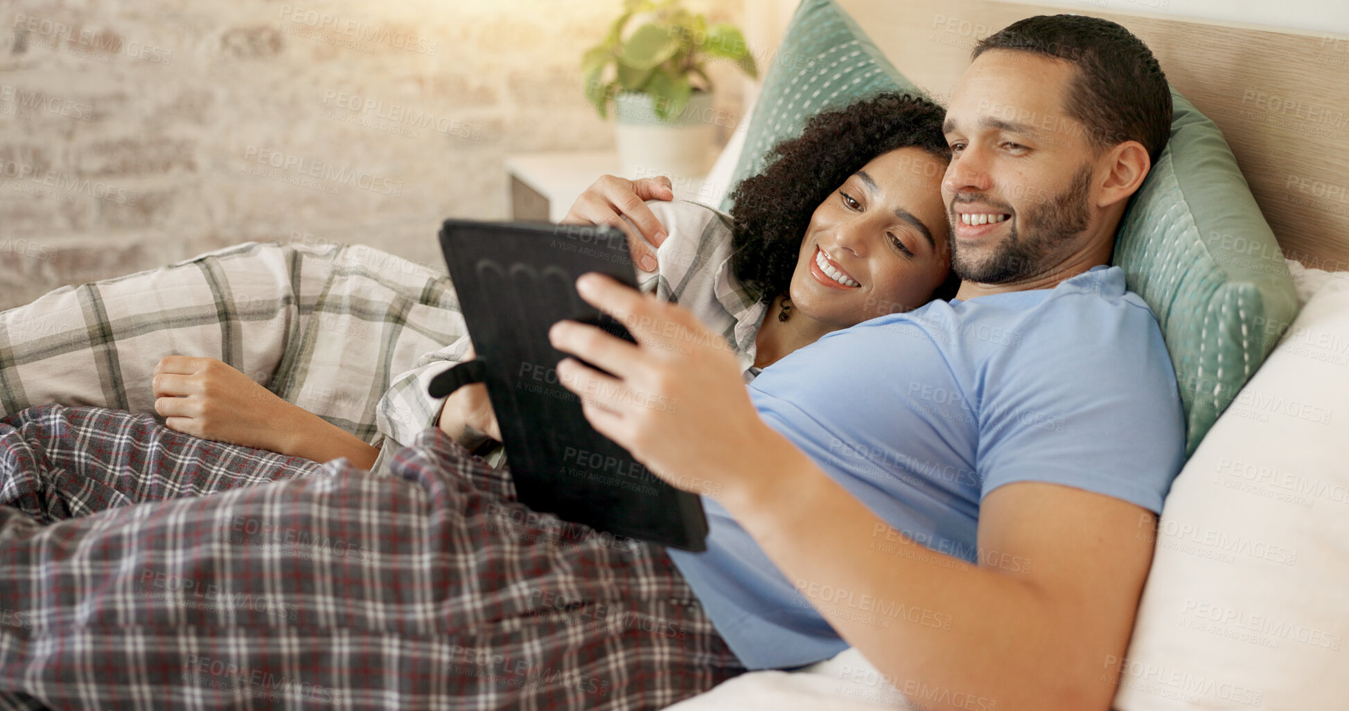 Buy stock photo Couple, tablet and scroll in bed, morning and bond with internet video, movie and meme for love, care and hug. Man, woman and digital touchscreen for typing, social network app or web blog in house