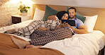 Couple, happy and relax in bedroom with tablet at night, streaming movie and hug. Smile, technology and man and woman in bed on social media app, watching online video and bonding together in home.