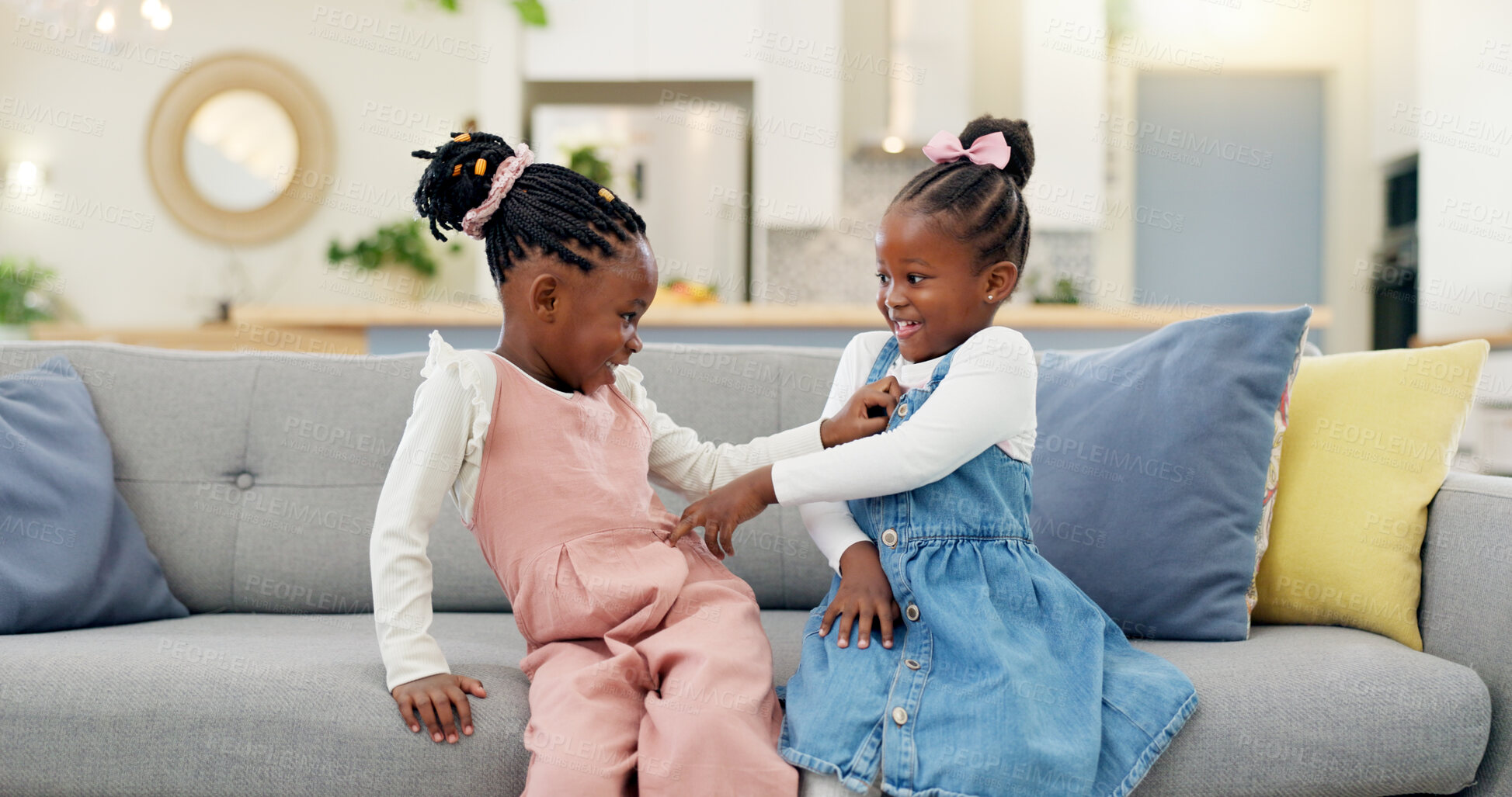 Buy stock photo Kids, play and couch in a home with poke, smile and happy from sibling bonding together. House, lounge sofa and daughter friends with game and girl friendship with fun and youth in a living room