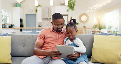 Family, man with child and tablet on sofa living room of their home for social media. Technology or internet, connectivity or bonding time and black man with his daughter together playing a game