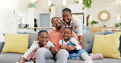 Happy, black family on sofa and in living room of their home happy together for care. Support or love, happiness or positivity and African people cuddle on couch in their house for bonding time