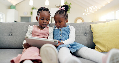 Black girl children, tablet on sofa and online with elearning or watching cartoon movie, sisters at home and screen time. Young female kids, streaming and subscription to education app or film