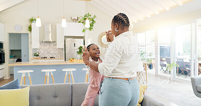 Excited mom, child and dancing in living room with happiness, energy and bonding in home together. Black family, mother and daughter dance on sofa, music and quality time for woman and little girl.
