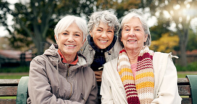 Senior, women sitting and friends face in park with retirement smile in a garden. Nature, portrait and hug with elderly female people on vacation in woods feeling happy from bonding and freedom